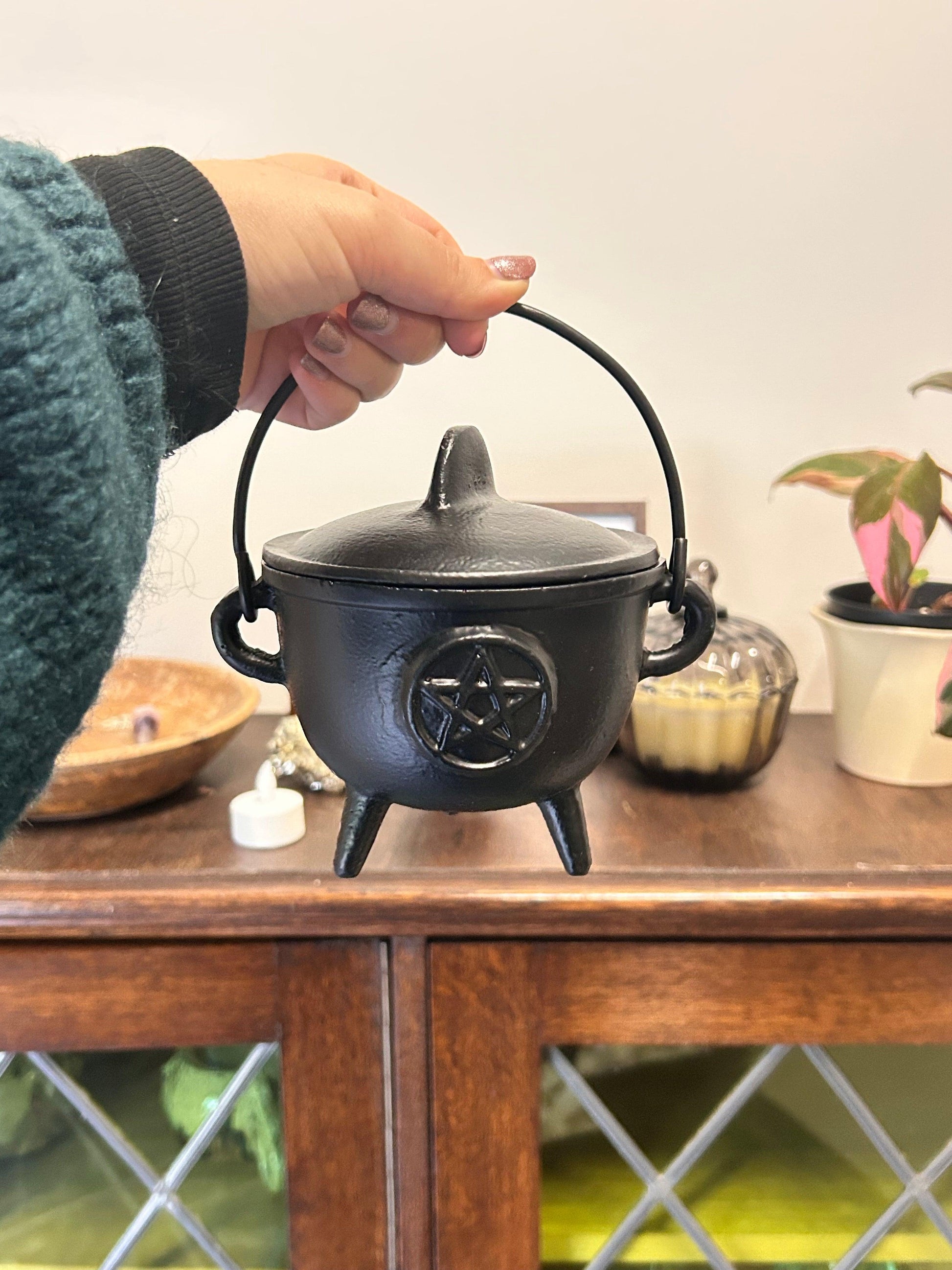cast iron cauldron with pentagram