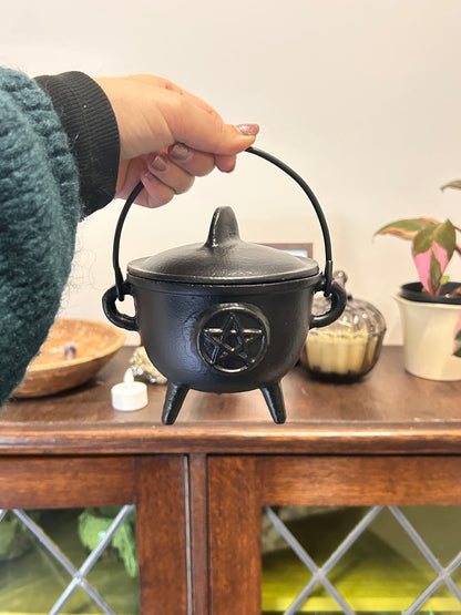 cast iron cauldron with pentagram