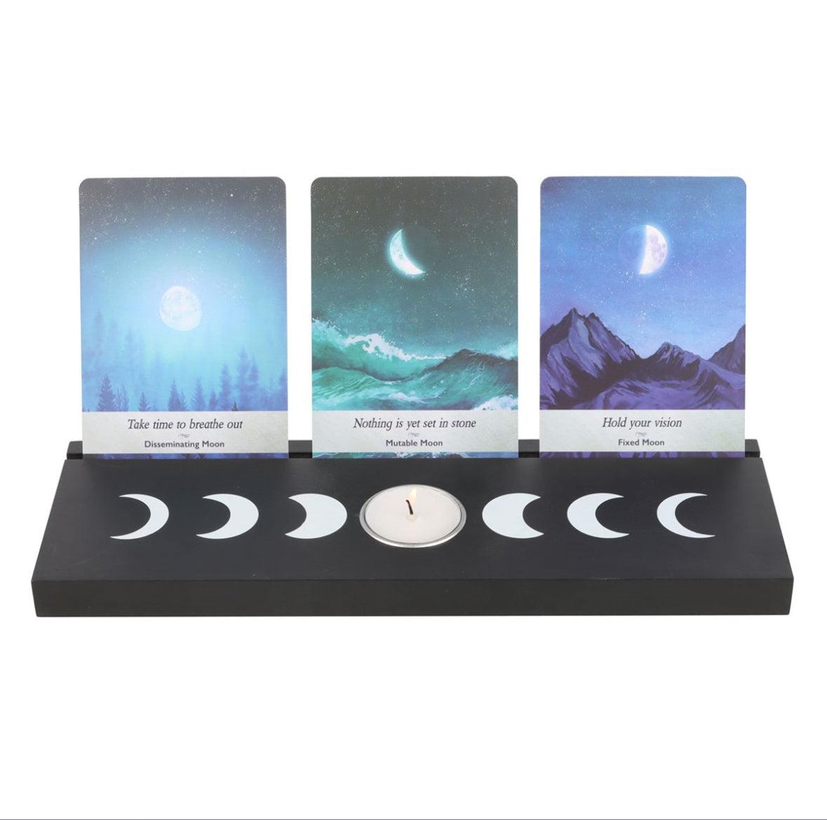 black stand with moon phases for tarot cards